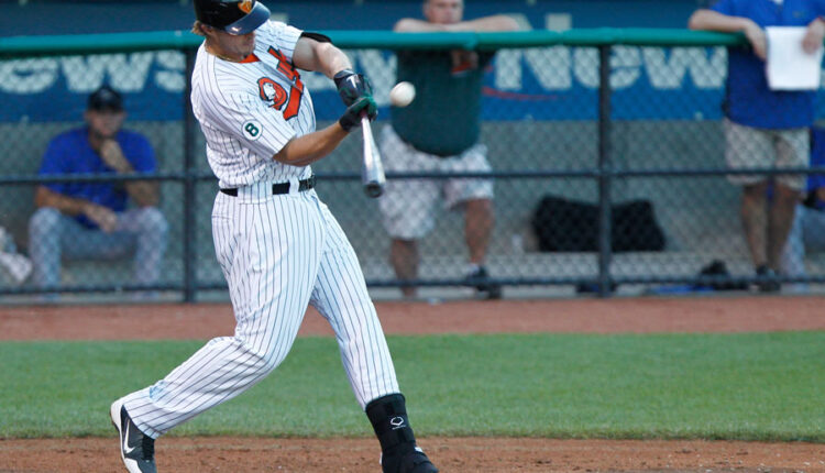 Long Island Ducks infielder Brandon Sing (23) connects for a single against the Sugar Land Skeeters during an Atlantic League matchup at then Bethpage Ballpark in Central Islip, New York. The Ducks went on to win the game as part of their 2012 championship season. Central Islip – July 21, 2012