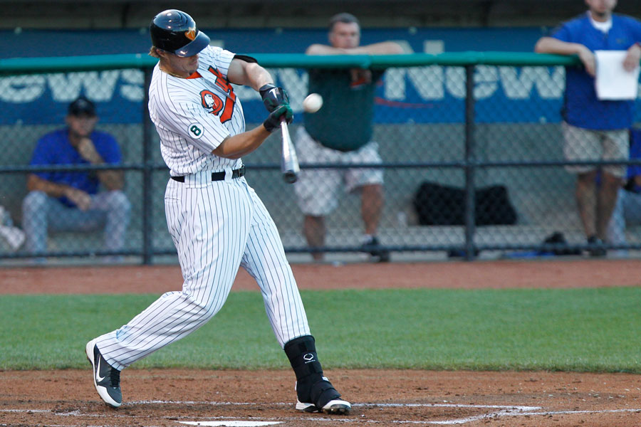 Long Island Ducks infielder Brandon Sing (23) connects for a single against the Sugar Land Skeeters during an Atlantic League matchup at then Bethpage Ballpark in Central Islip, New York. The Ducks went on to win the game as part of their 2012 championship season. Central Islip – July 21, 2012