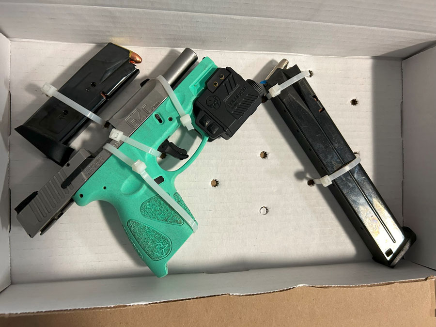 A loaded Taurus G2C 9mm handgun with laser sight and multiple high-capacity magazines recovered by Nassau County Police during a July 29, 2025 traffic stop in Uniondale. The firearm and suspected narcotics were seized from inside the vehicle, leading to the arrest of two individuals.