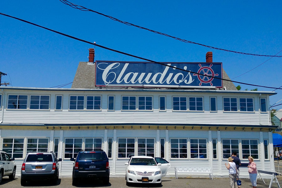 Claudios Restaurant in Greenport is a true Long Island landmark, known as the oldest same-family-run restaurant in the United States until recently. Set along the Greenport waterfront since 1870, it’s famous for its fresh seafood, lively marina setting, and role as a centerpiece of North Fork dining. With its iconic sign and historic charm, Claudio’s captures both the heritage and flavor of Long Island’s East End.