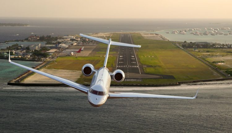 A private jet makes its approach over the water toward a coastal runway, symbolizing one of the many ways to reach Long Island by air. With commercial flights arriving at MacArthur Airport and private aircraft landing at Republic or East Hampton, flying remains one of the fastest and most convenient options for travelers coming to the Island.