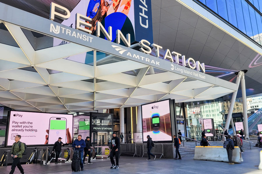 New York, New York, USA - March 25, 2025: Penn Station entrance on 6th Avenue in Manhattan. People can be seen.