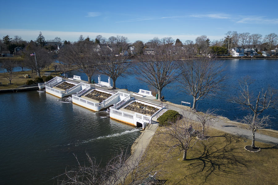 Aerial view of Argyle Lake Park in nearby Babylon Village, showing the cascading waterfalls and tree-lined lakefront on a clear February afternoon in 2023. This scenic spot, just minutes from West Babylon, is a popular destination for walking, fishing, and enjoying the outdoors.