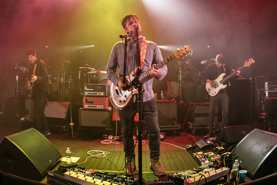 Modest Mouse performing live on stage during their U.S. tour. The band will bring their indie rock anthems to The Paramount in Huntington, NY, on October 20, 2025, with support from Built to Spill