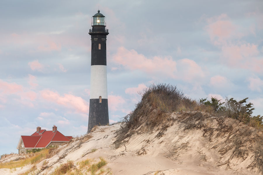 The Fire Island Lighthouse is a iconic landmark on the Great South Bay, in southern Suffolk County, New York on the western end of Fire Island, a barrier island off the southern coast of Long Island.