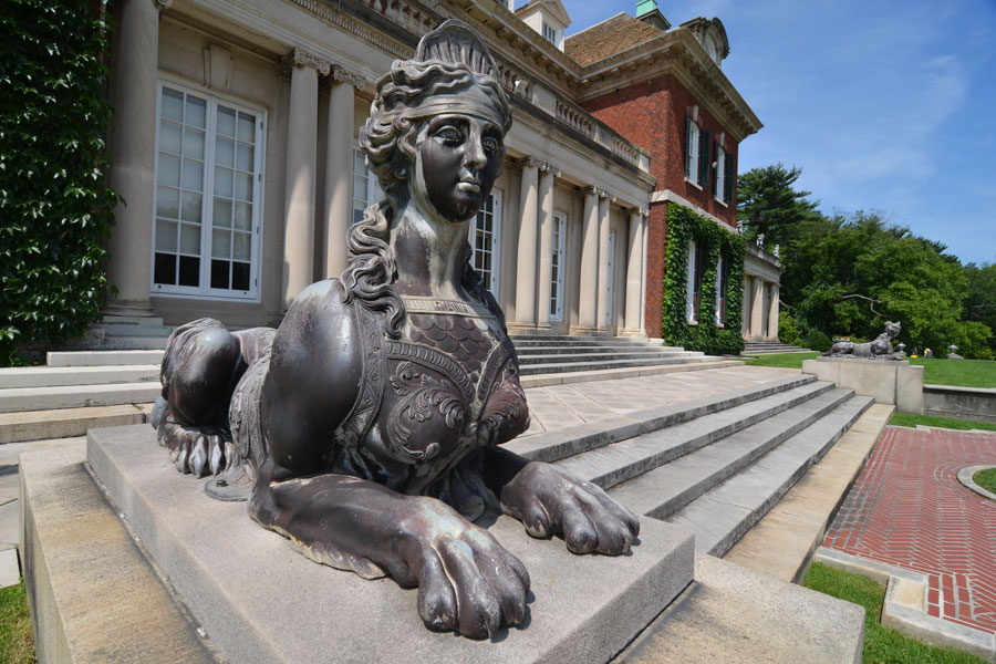 A detailed sphinx sculpture at the entrance of a Gold Coast mansion in Old Westbury, Long Island, photographed on July 3, 2015. The estate reflects the grandeur of the Gilded Age, when wealthy industrialists built opulent homes across Long Island’s North Shore.
