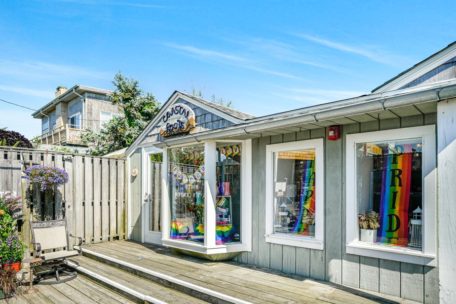 Cherry Grove, United States - June 24, 2025: Cherry Grove Post Office, Fire Island, post office, LGBTQ history, pride flags, beach community, historic building, small town.