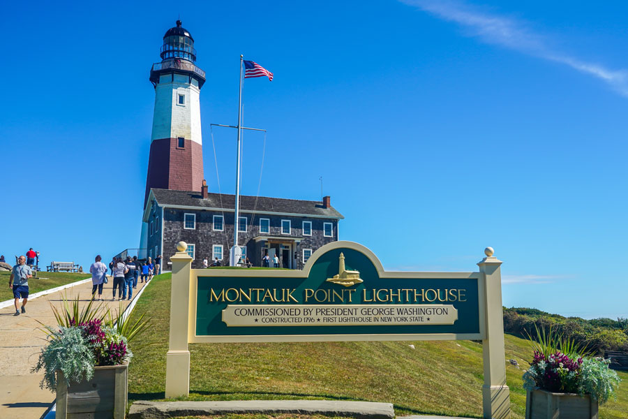 Montauk Point Lighthouse itself is a historic landmark, commissioned by President George Washington and constructed in 1796, as shown in the sign. mIt is the oldest lighthouse in New York State and a registered National Historic Landmark.