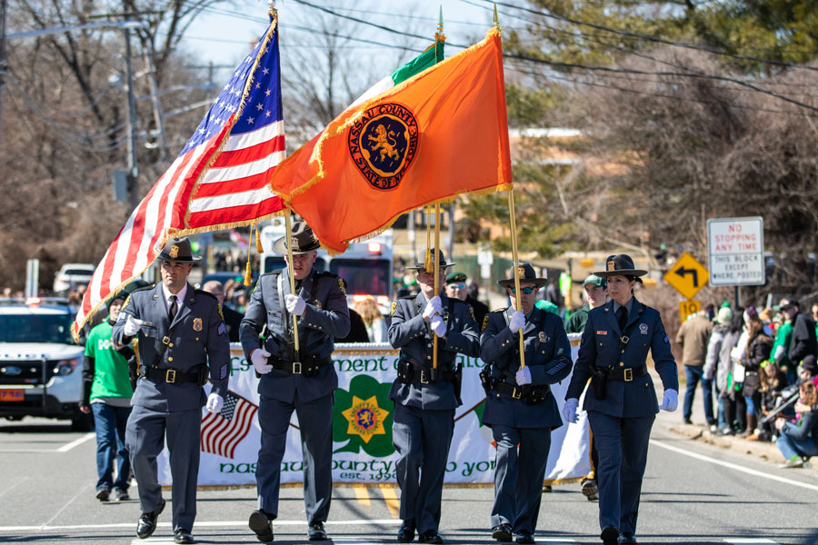 Wantagh, New York - March 17, 2019 : Nassau County Police Department marching in the first Annual St. Patrick’s Day Parade. Long Island