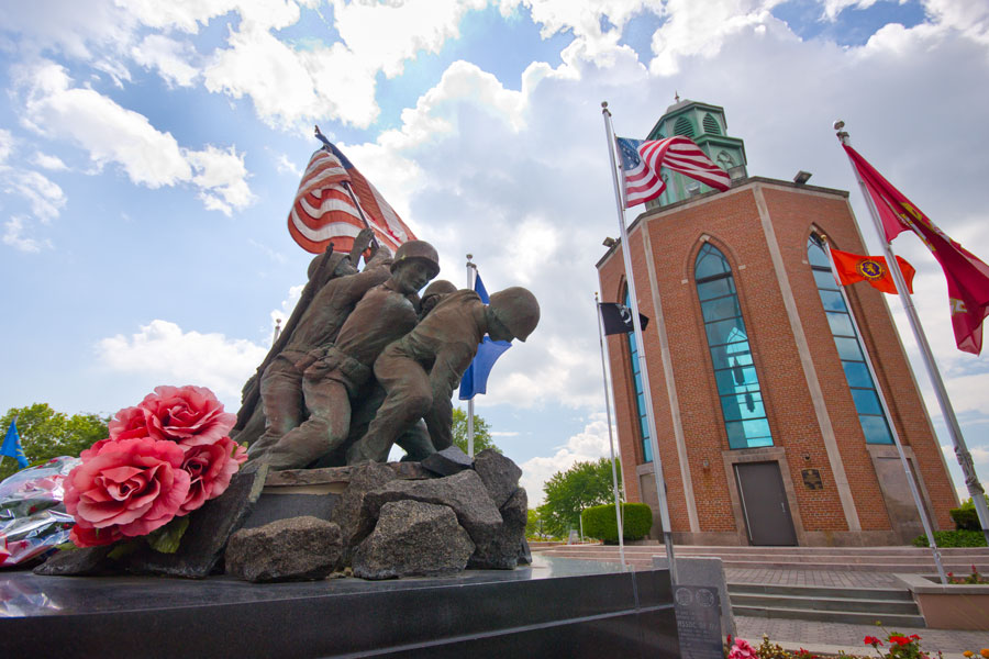 The Veterans Memorial at Eisenhower Park in East Meadow, NY is a prominent monument serving as a tribute to the heroes of Nassau County who served in various branches of the U.S. armed forces.