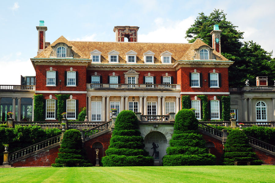 A grand Gilded Age mansion in Old Westbury, Long Island, photographed on June 30, 2020. The estate reflects the opulence of Long Island’s Gold Coast era, with its stately brick façade, manicured gardens, and classical architectural details that have been preserved as a reminder of the area’s historic wealth and elegance.