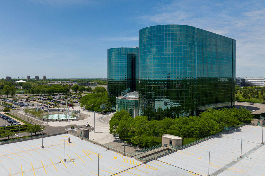 This image depicts RXR Plaza, a prominent office complex located in Uniondale, Nassau County, New York. The twin, mirrored glass towers are an iconic part of Nassau’s business landscape and represent one of the most recognizable hubs for corporate activity on Long Island.