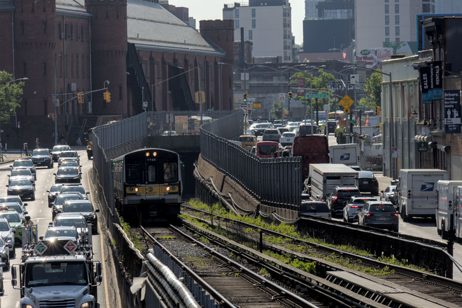 Long Island commuters spend about 34 minutes traveling to work on average, with 73% driving alone and only 12% using public transit. Transit use is significantly higher in Nassau than Suffolk due to proximity to New York City and denser LIRR service. The Long Island Rail Road carries around 185,000 riders daily, while the Long Island Expressway and parkways see hundreds of thousands of vehicle trips each day.
