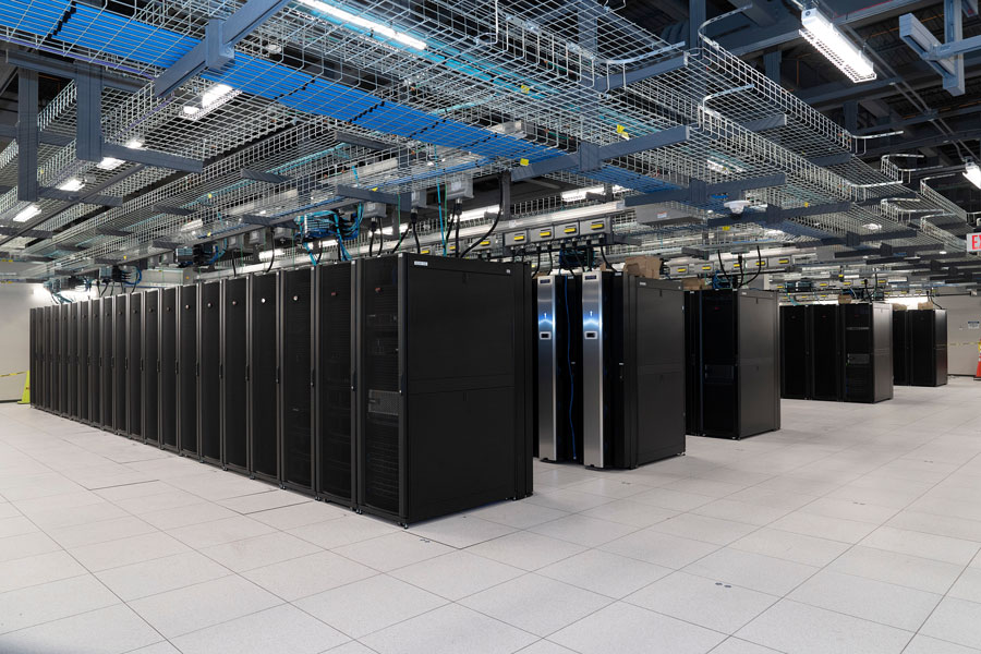The Scientific Data and Computing Center (SDCC), pictured here in February 2022, serves as Brookhaven National Laboratory’s hub for high-performance computing. Originally known as the RHIC and ATLAS Computing Facility, the center manages massive amounts of experimental data from some of the world’s most advanced physics experiments. Its powerful servers and advanced infrastructure support scientists working on particle collisions, climate modeling, and other data-intensive research. The SDCC highlights Brookhaven’s role as a global leader in both discovery and computational science.