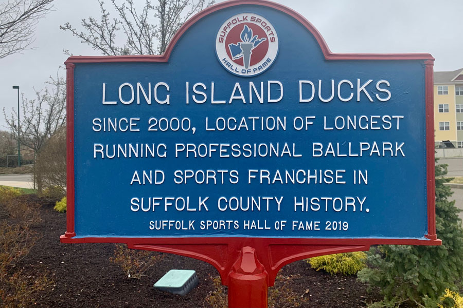 Central Islip, NY, USA, 2.22.22 - The plaque at a baseball stadium says "LONG ISLAND DUCKS" and gives the history of the longest running professional ballpark in Suffolk County history.