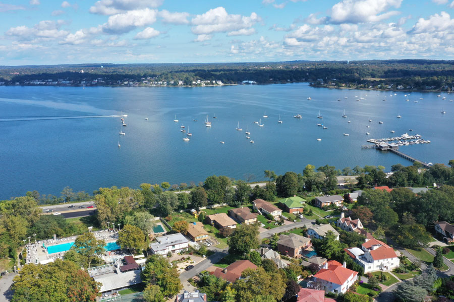 Aerial view across Little Neck Bay toward Kings Point on Long Island’s North Shore, as seen from the Bayside section of Queens. The area is known for its waterfront estates, sailing, and historical connection to F. Scott Fitzgerald’s The Great Gatsby.
