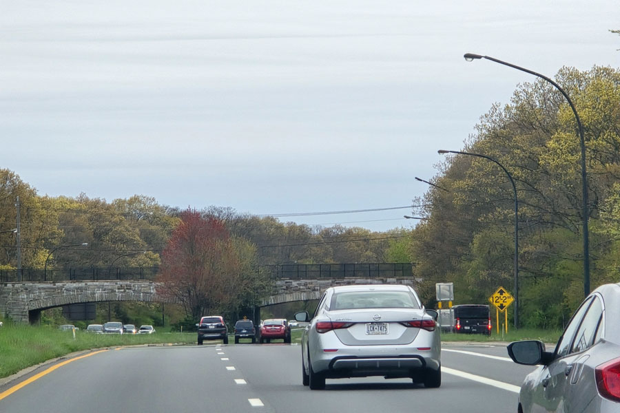 The Bethpage State Parkway, also known as the Philip B. Healey Memorial Parkway, connects the Southern State Parkway in North Massapequa to Bethpage State Park. This short, scenic route winds through the Massapequa Preserve and ends at a circular entrance to the park. Designed by Robert Moses in the 1930s, it remains a tranquil gateway to one of Long Island’s premier recreation areas.