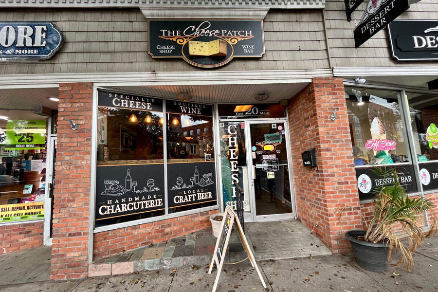 The Cheese Patch, a longtime favorite in downtown Patchogue, pictured on East Main Street before its closing. After serving the community for over 13 years with artisan cheeses, boutique wines, and charcuterie, the shop officially shut its doors in 2024. Its closure marks the end of a local era, with Main Street Apothecary set to take its place and continue the tradition of bringing unique experiences to the neighborhood.