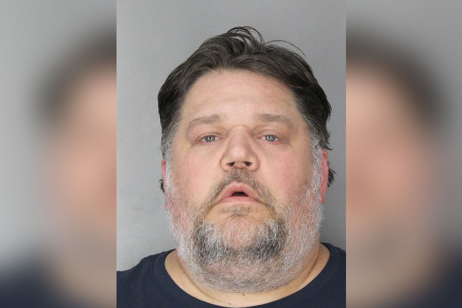 Head-and-shoulders booking photo of an adult male with short dark hair and beard, identified by police as Jeffrey Butt, arrested after an alleged drug-impaired crash in Merrick, New York.