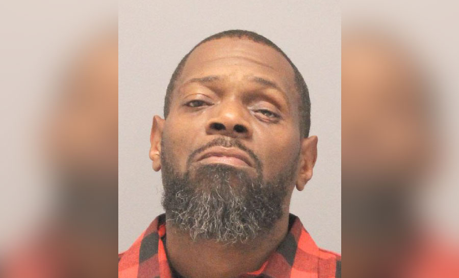 Head-and-shoulders booking photo of an adult male with short hair and a beard, identified by police as Thomas Haynes, arrested in North Lawrence, New York, after a firearm was found during a traffic stop.