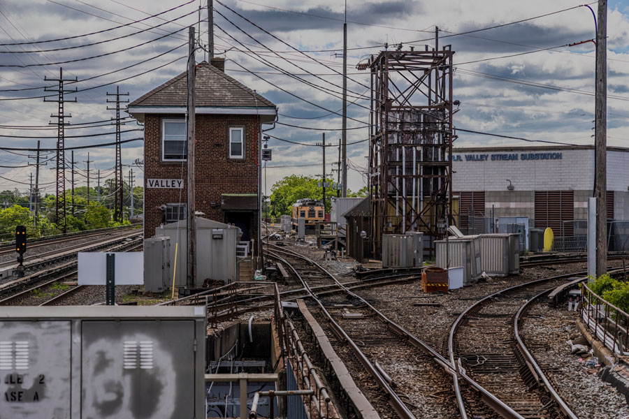Valley Stream, NY United States - June 1, 2025: A straight on shot of the Valley Stream, NY Long Island Railroad station house and substation, taken on a cloudy day.