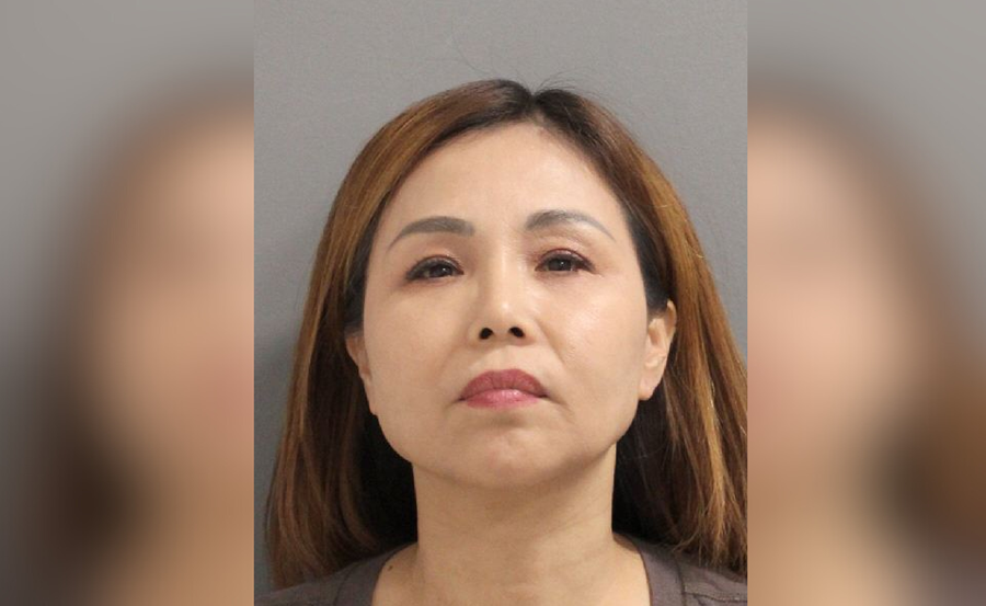 Mugshot of Xiujuan Zhang, 51, arrested in Massapequa for offering unlicensed massages and prostitution-related charges, later taken into ICE custody.