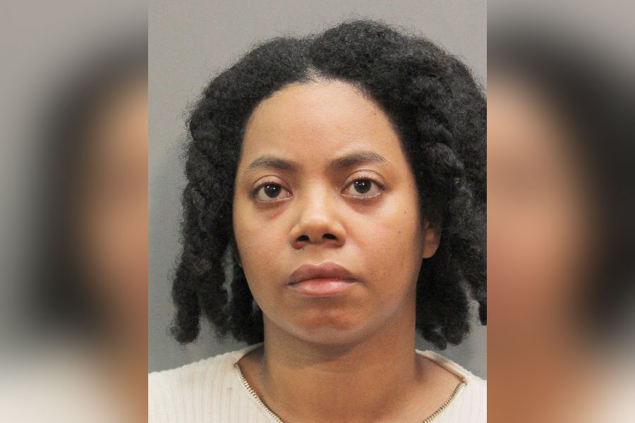 olice booking photo of a woman with short, curly hair and neutral expression, identified by Nassau County Police as Amanda A. Fraser, the suspect in an attempted murder case involving an elderly Massapequa resident.