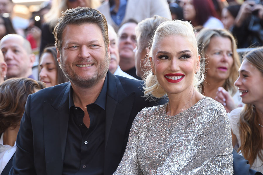 Blake Shelton and Gwen Stefani smiling together at Gwen Stefani’s Hollywood Walk of Fame ceremony on October 19, 2023, in Los Angeles.