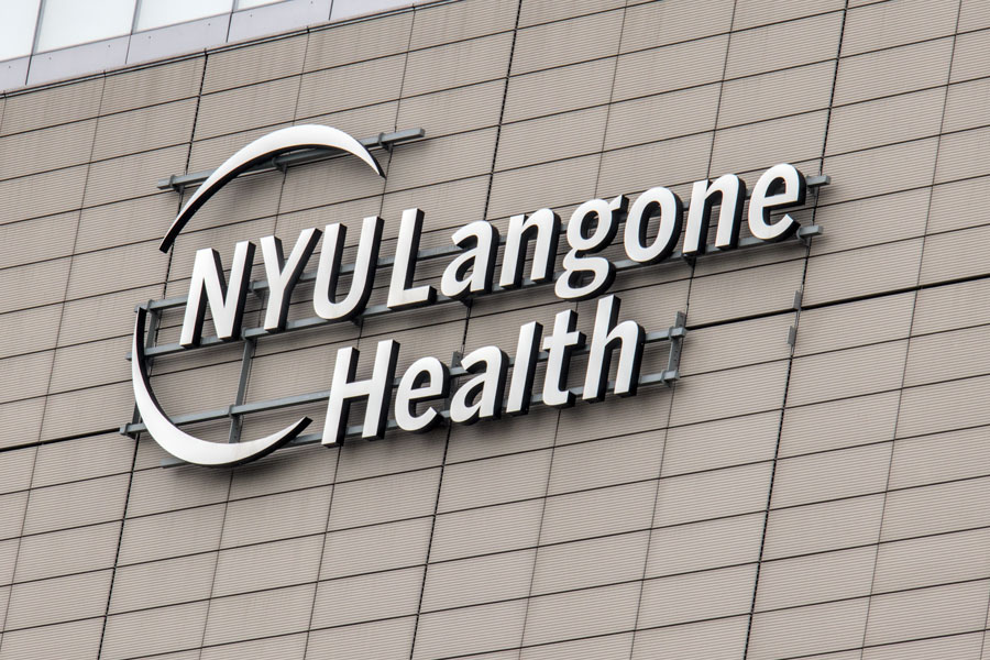 Exterior signage displaying the NYU Langone Health logo, representing the healthcare network that now operates the former Long Island Community Hospital in Patchogue, officially renamed NYU Langone Hospital – Suffolk.