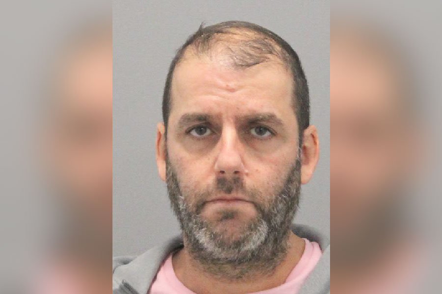 Mugshot of Sharon Zharfati, a 51-year-old man from Woodmere, New York, who was charged with Robbery and Assault for allegedly punching and kicking an elderly driver after a vehicle collision.