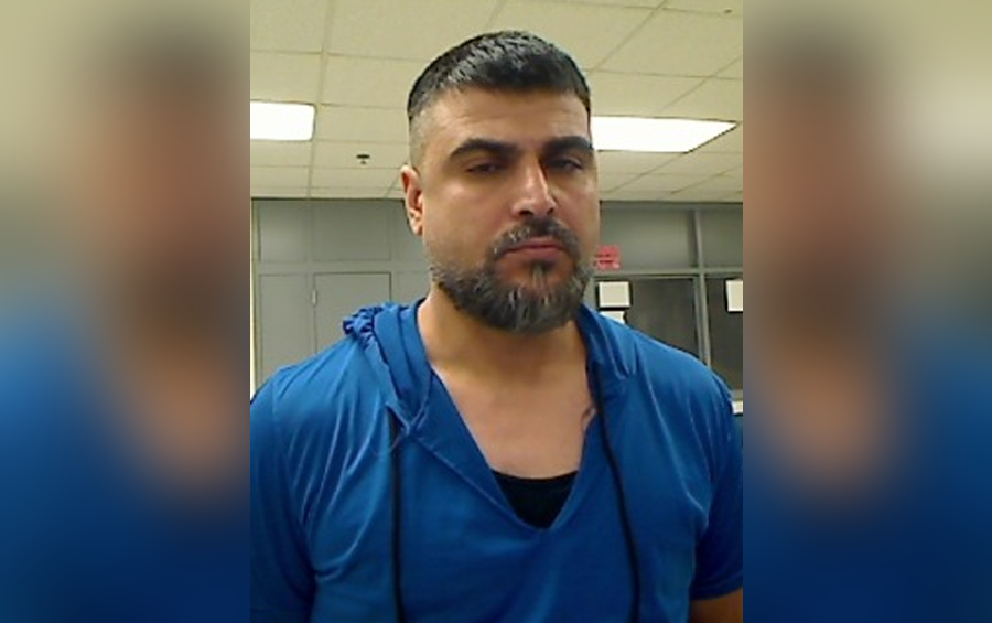 Mugshot of a man detained by ICE following a violent struggle during an apprehension operation in Tonawanda, New York.