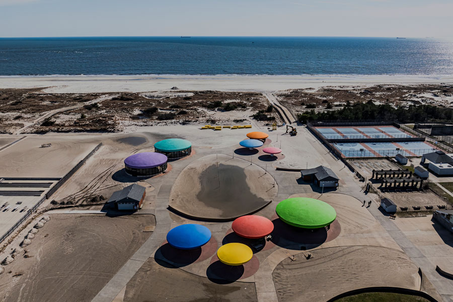 Aerial view of Town Park at Lido Beach with colorful pavilions, sandy beachfront, and the Atlantic Ocean beyond.