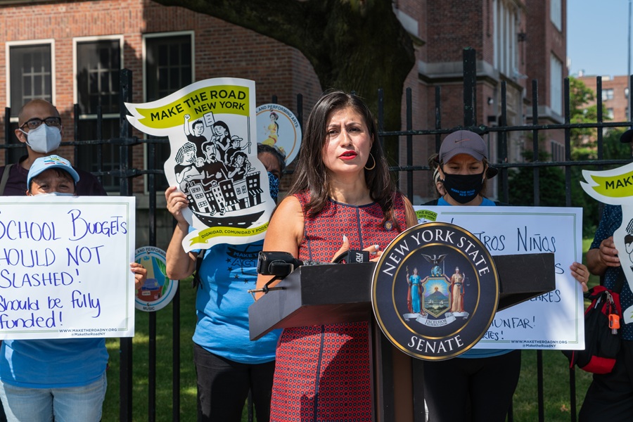Public rally outside a New York public school highlighting concerns about school funding and annual education budget decisions