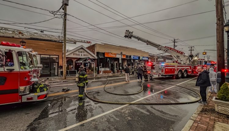 Multiple Long Island fire departments responding to a multi-alarm fire, illustrating coordination between independent fire districts rather than town or village agencies