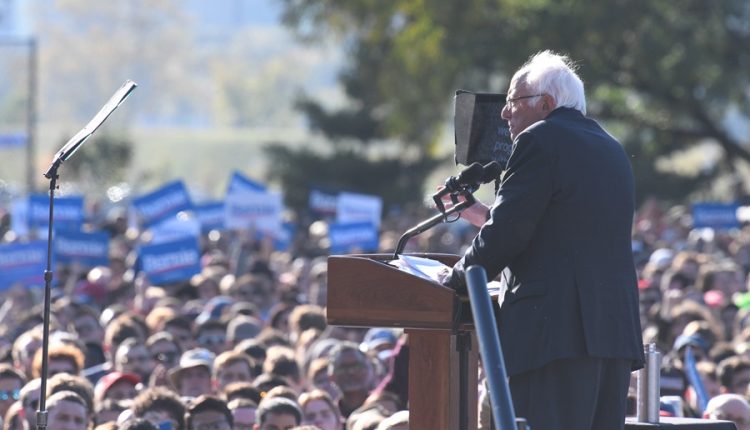 Crowd gathered at a political rally during an election cycle, illustrating civic engagement and voter participation