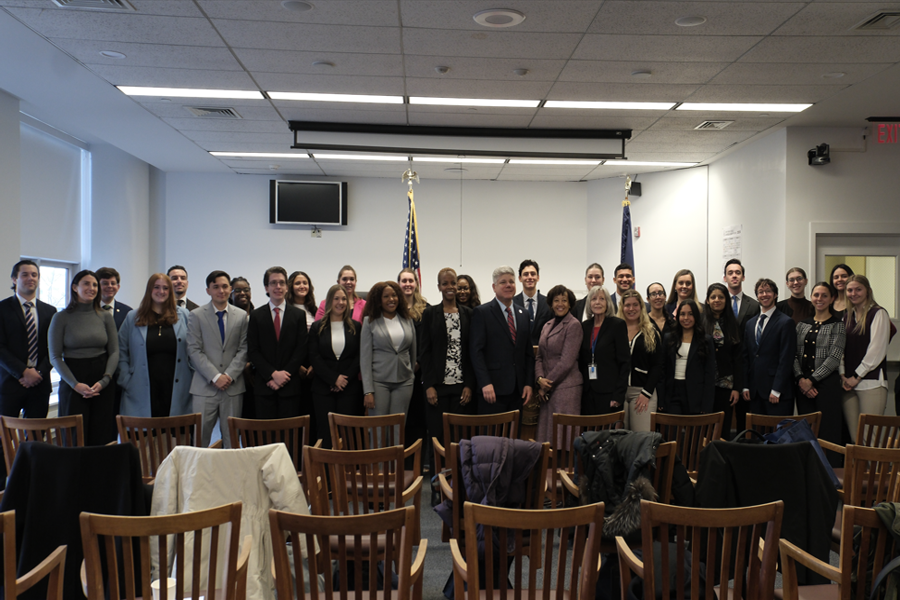 Judge Joseph, DAJ Crecca, Z. Taylor, Esq., and Dean Berman stand with volunteer Touro Law students