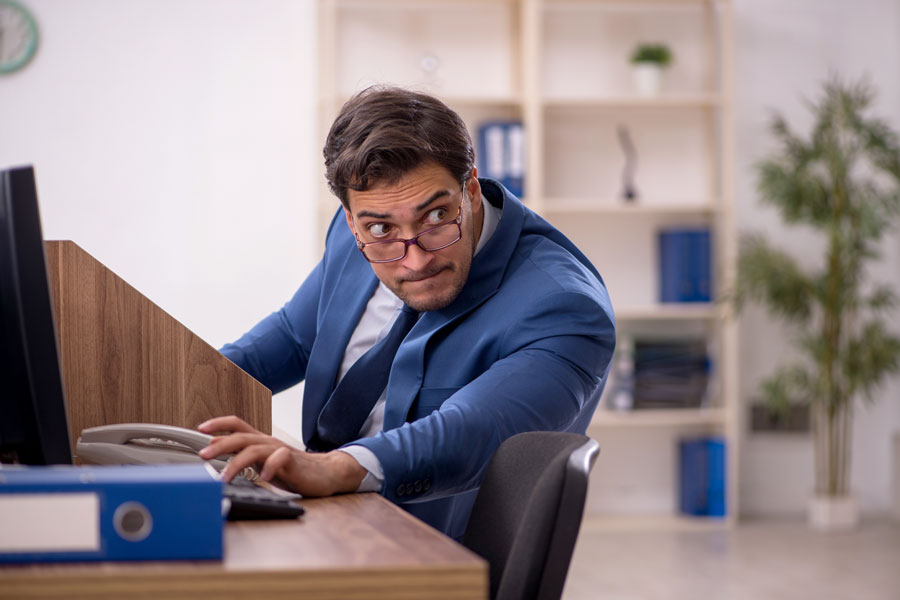 Young male employee working in the office