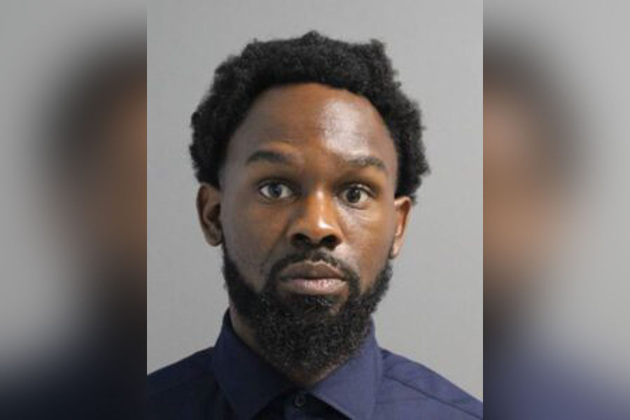 Booking photo of Travis Austin, an Islip man sentenced to 12 years in prison for narcotics trafficking and illegal firearms sales in Suffolk County.