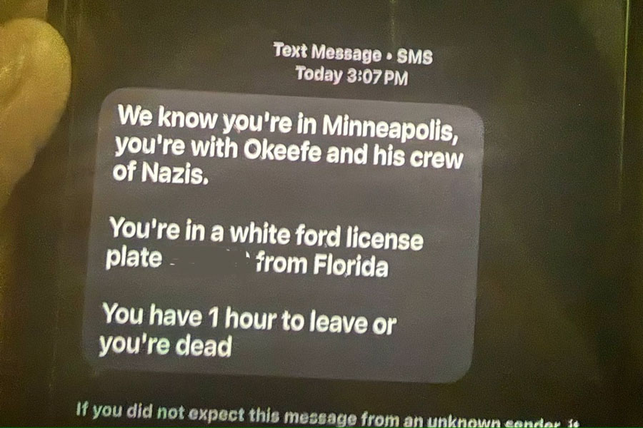 A threatening text message received by members of O’Keefe Media Group while reporting in Minneapolis, according to the organization. The message references the team’s location, vehicle details, and issues an explicit death threat demanding they leave the area within one hour. O’Keefe Media Group says the threat was reported to federal authorities as part of a broader pattern of harassment during the assignment.
