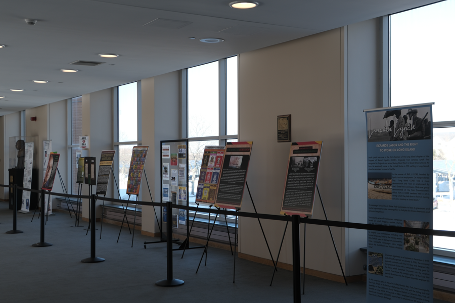 Educational displays and historical exhibits line the courthouse mezzanine, highlighting key moments in Black history as part of the Suffolk County Courts’ Black History Month observance.
