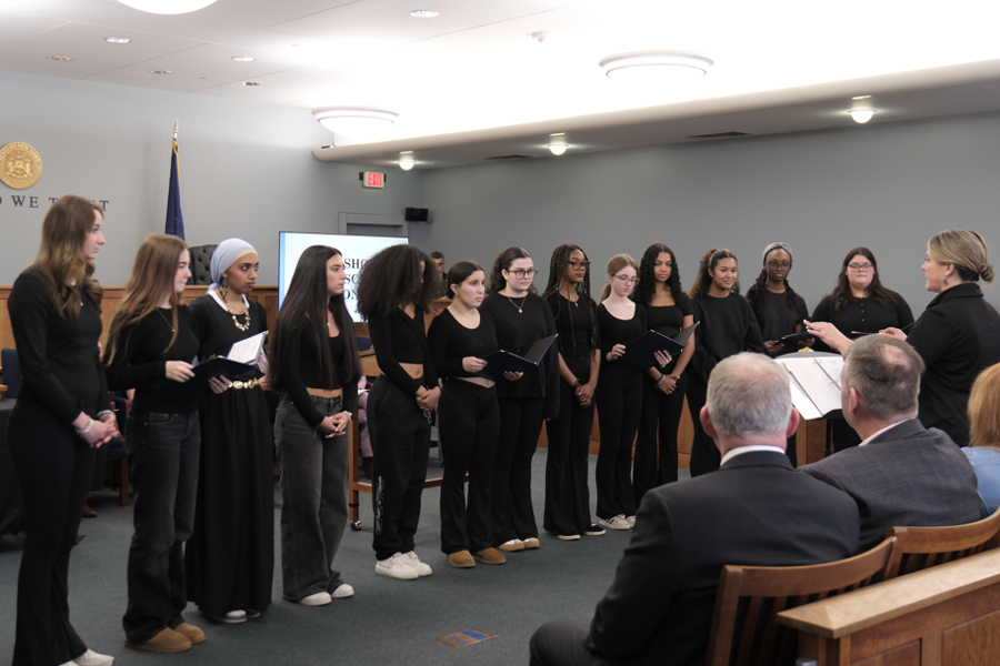 Members of Bay Shore High School’s ‘Harmonaires’ prepare to perform a song for the ceremony.