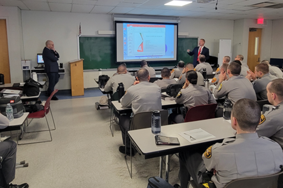 Edward Gialella, Program Director for Suffolk County Problem-Solving Courts, speaks with police cadets about specialized courts, including Drug Court and Integrated Domestic Violence Court, and their impact on reducing recidivism.