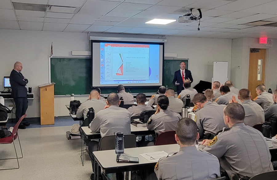 Edward Gialella reviews Suffolk County’s problem-solving court programs with cadets as Acting Supreme Court Justice Hon. John Iliou observes during a joint presentation at the Police Academy.
