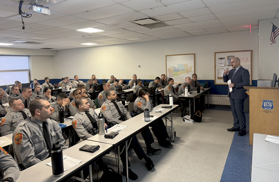 Hon. John Iliou delivers a legal lecture to members of the 194th Recruit Class at the Suffolk County Police Academy, providing insight into courtroom processes and the structure of Suffolk County’s justice system.