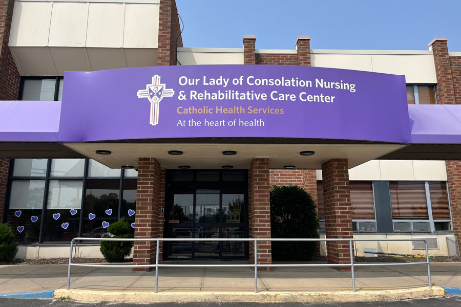 Exterior view of Our Lady of Consolation Nursing and Rehabilitative Care Center, a Catholic Health Services facility providing long-term care and rehabilitation services on Long Island. West Islip, New York - July 1, 2023