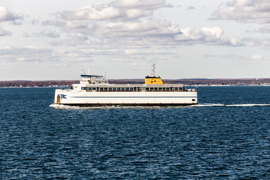 Sag Harbor Bay, Long Island, New York – The ferry MV John crosses the bay near Sag Harbor, connecting the East End’s coastal communities as boats and open water stretch toward Shelter Island in the distance. 