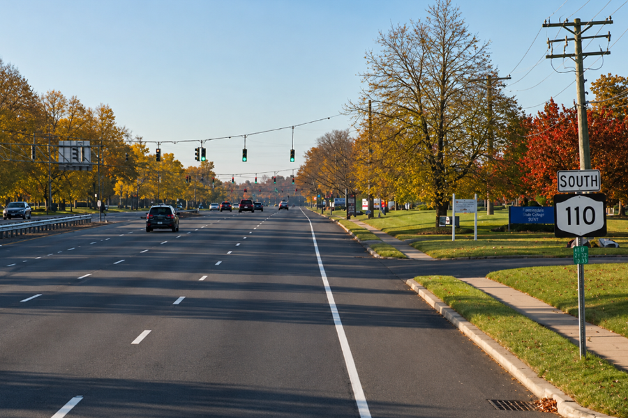 Facing south on Route 110 (Broadhollow Road) near the Long Island Expressway in Melville, this busy commercial corridor is one of Long Island’s most heavily traveled commuter and business routes, serving western Suffolk County with major retail, office, and regional highway connections.
