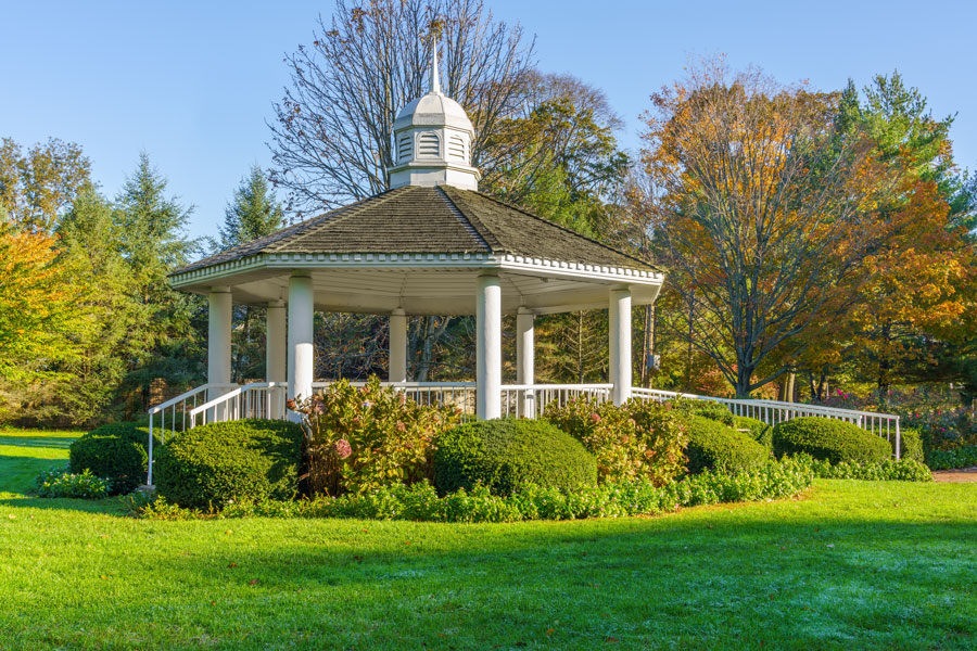 Gazebo surrounded by landscaped gardens and autumn foliage in the Garden City area of Long Island, New York, reflecting the suburban park-like character common throughout Nassau County communities.