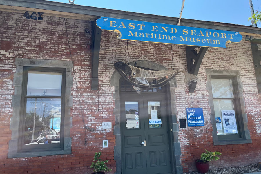 The East End Seaport Maritime Museum in Greenport, New York, welcomes visitors with its historic brick façade and classic maritime charm, offering a glimpse into Long Island’s rich seafaring past.