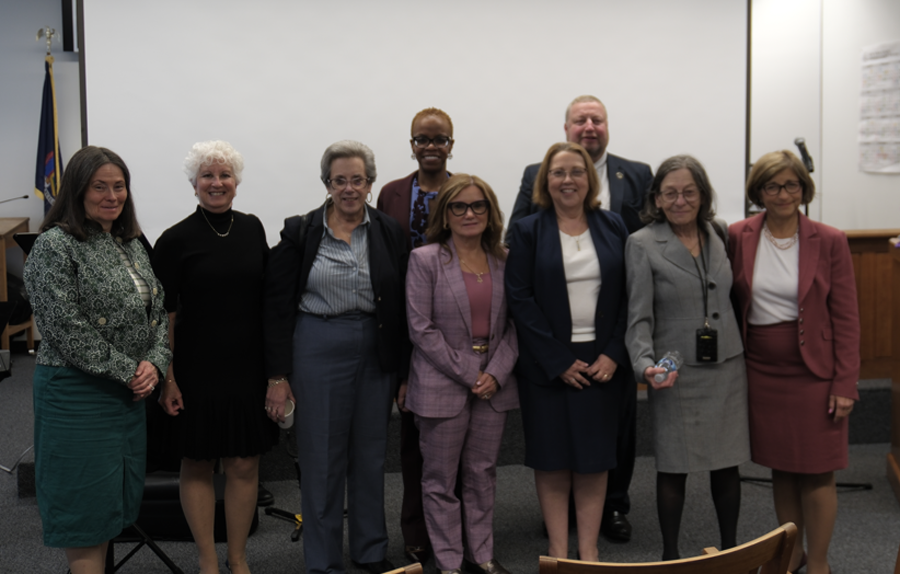 Members of the Court Jewish American Heritage Month Planning Committee stand together after the event